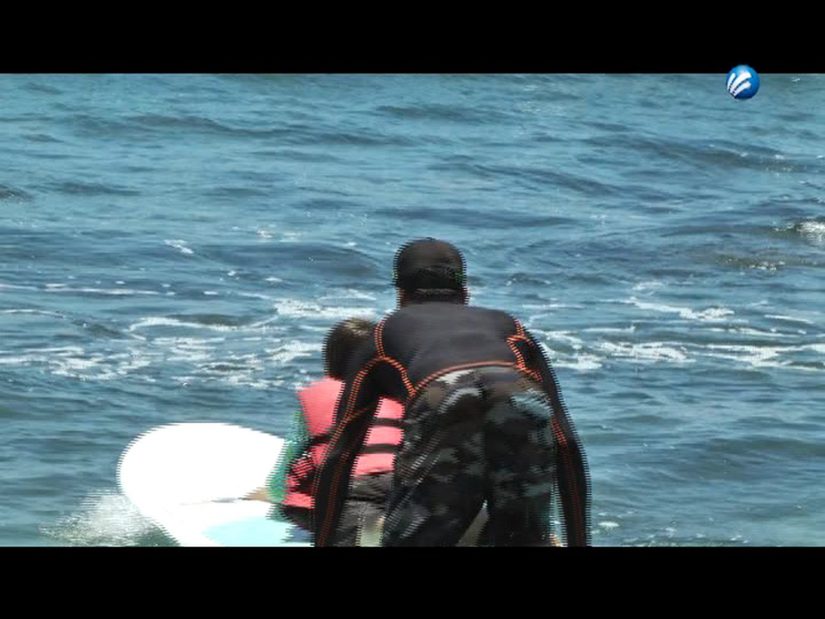 They perform therapies with surfing to autistic children
